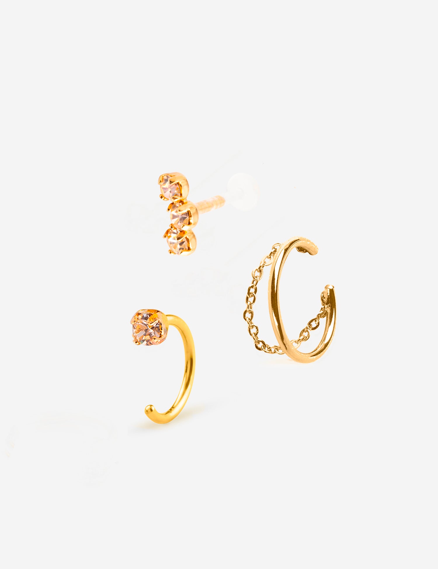 Combinaison de trois bijoux , deux puces d'oreilles champagne et une bague d'oreille avec chaine plaqué or
