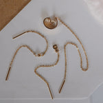 Boucles d'oreilles dorées avec chaîne April Please
