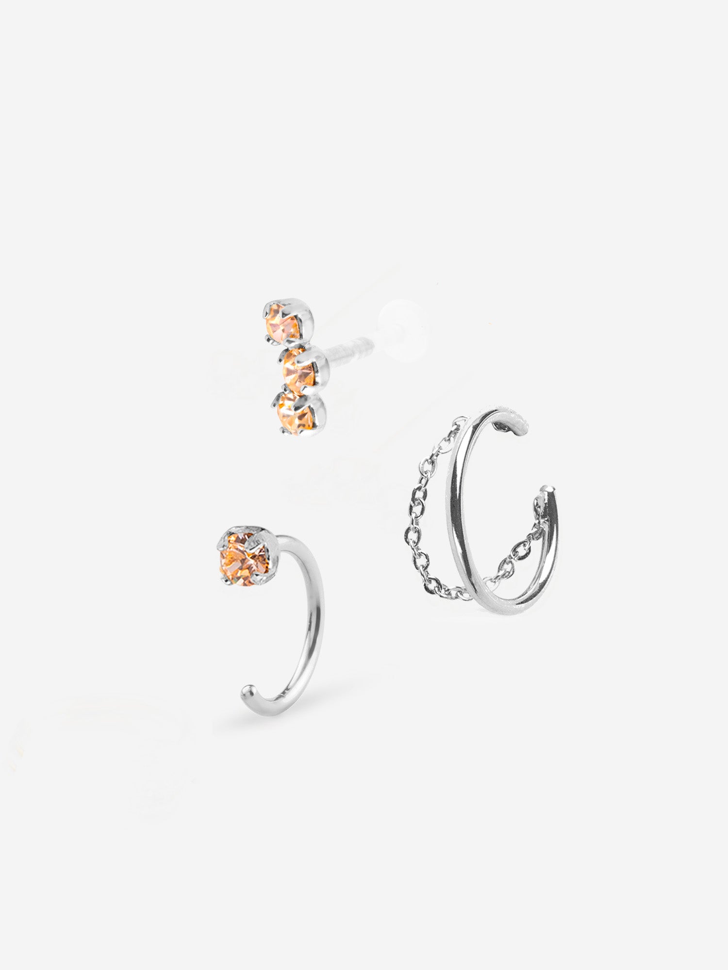 Combinaison de trois bijoux , deux puces d'oreilles champagne et une bague d'oreille avec chaine palladium